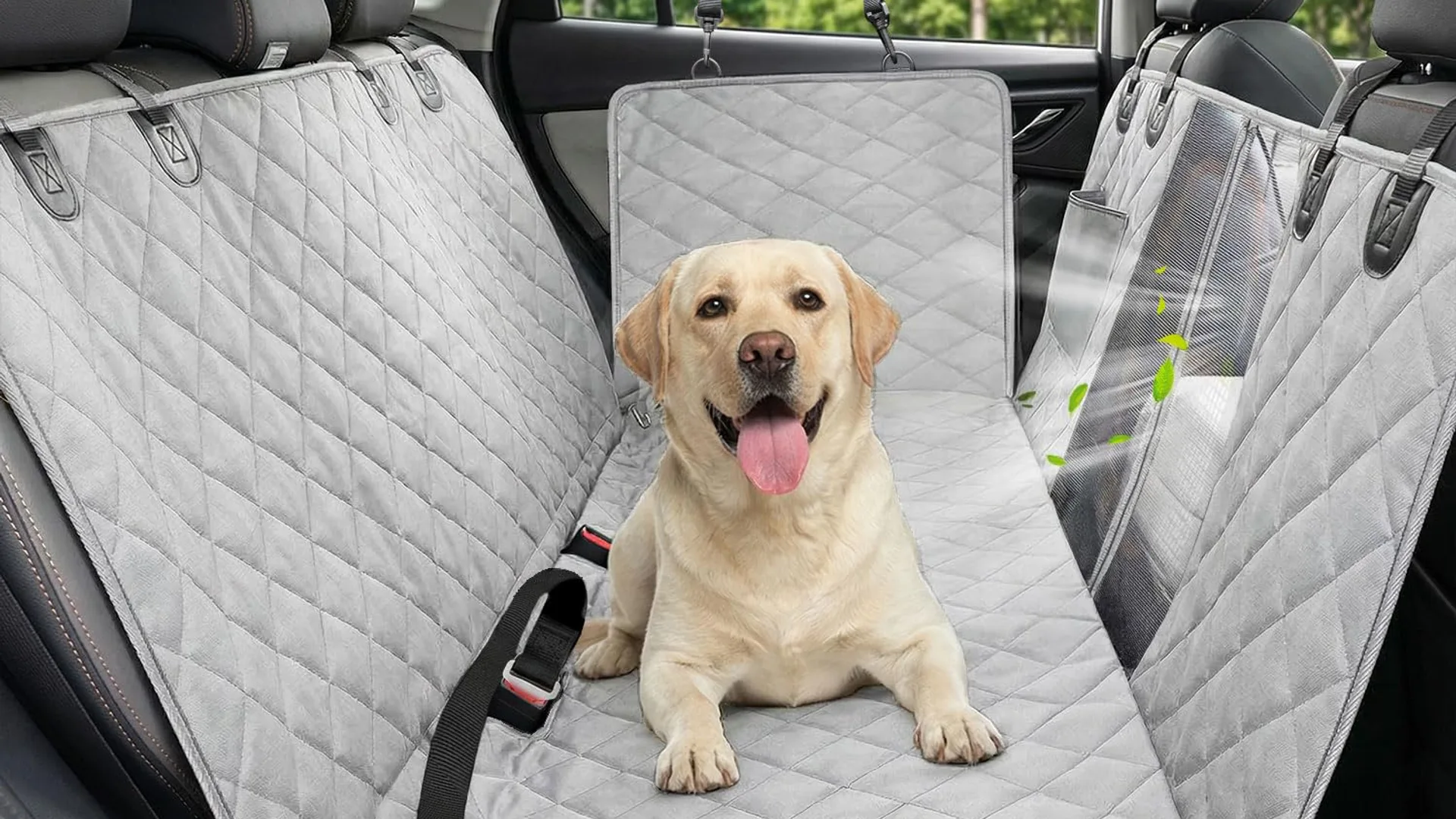 Yellow lab lying on a quilted gray dog car seat hammock cover